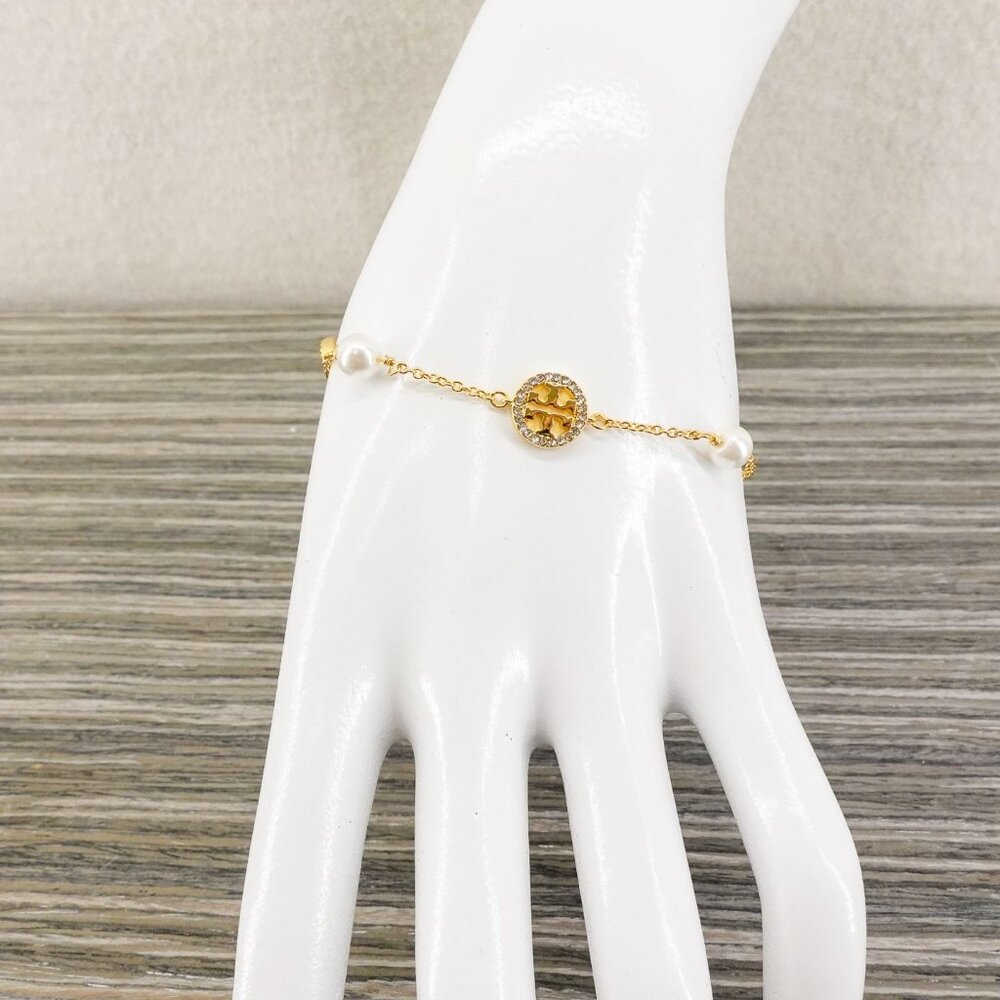 Tory Burch Crystal Logo & Imitation Pearl Station Bracelet Ivory/Tory Gold OS - Picture 10 of 16